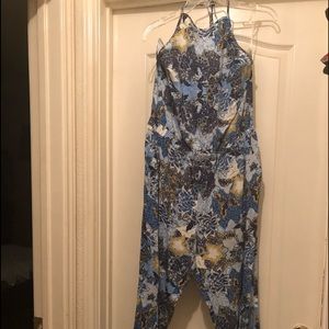 Quarter length never worn backless jump suit..